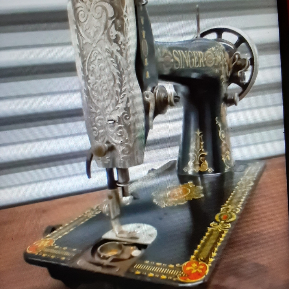 Antique singer red eye leather sewing machine